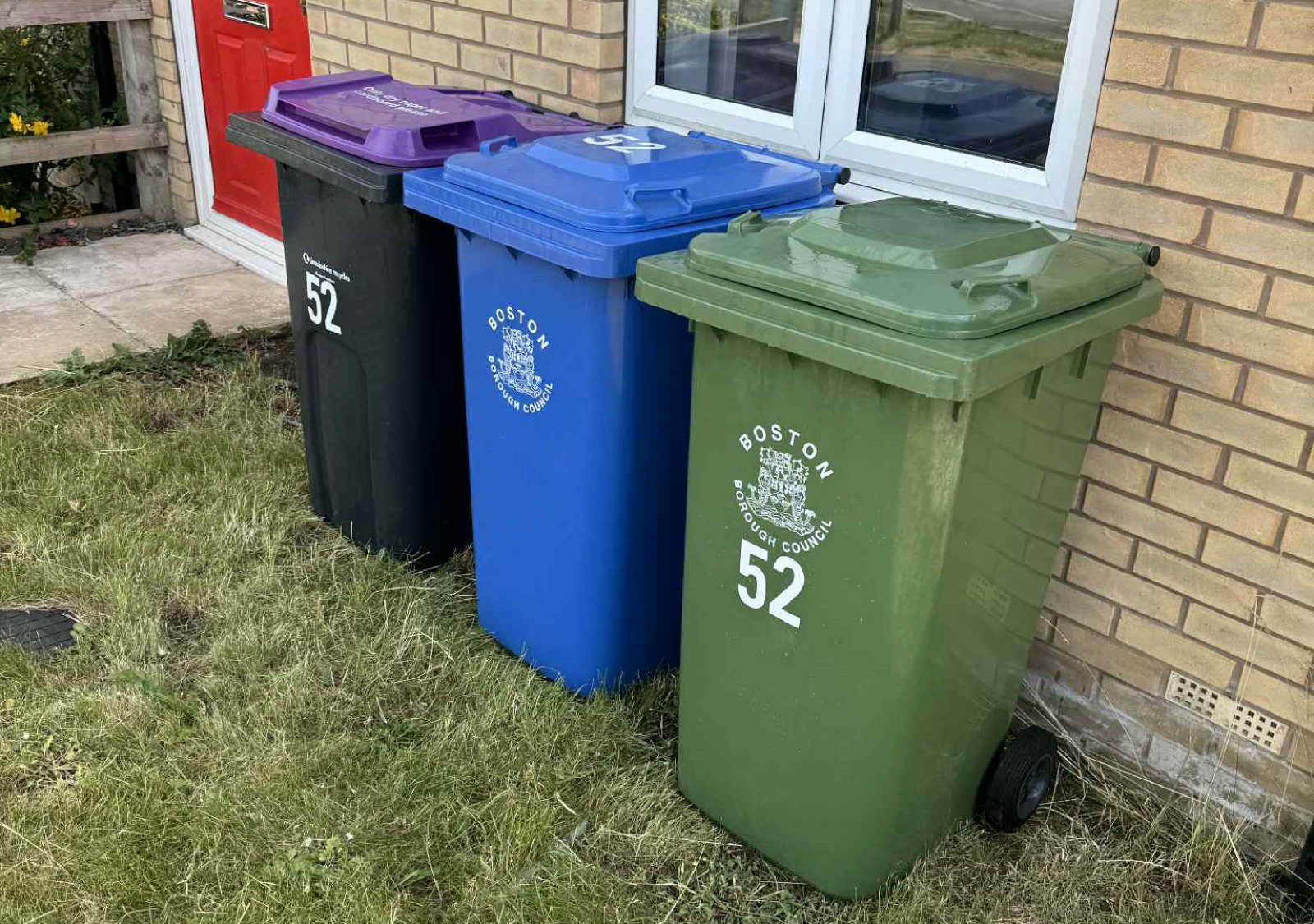 an image of multicoloured wheelie bins